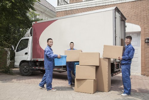 Staff separating cardboard and packaging for recycling at Ratcliff Storage